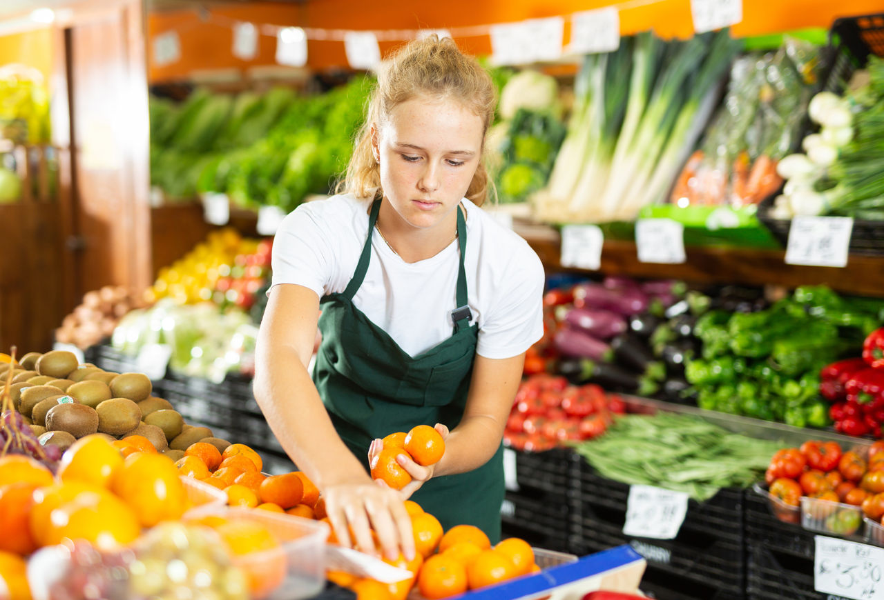 young woman working in grocery store