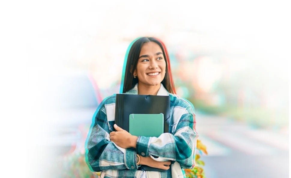 Student holding their notebooks.