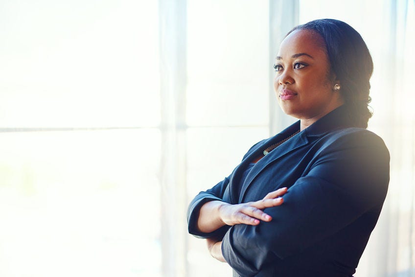 Cropped shot of a confident businesswoman standing in her office