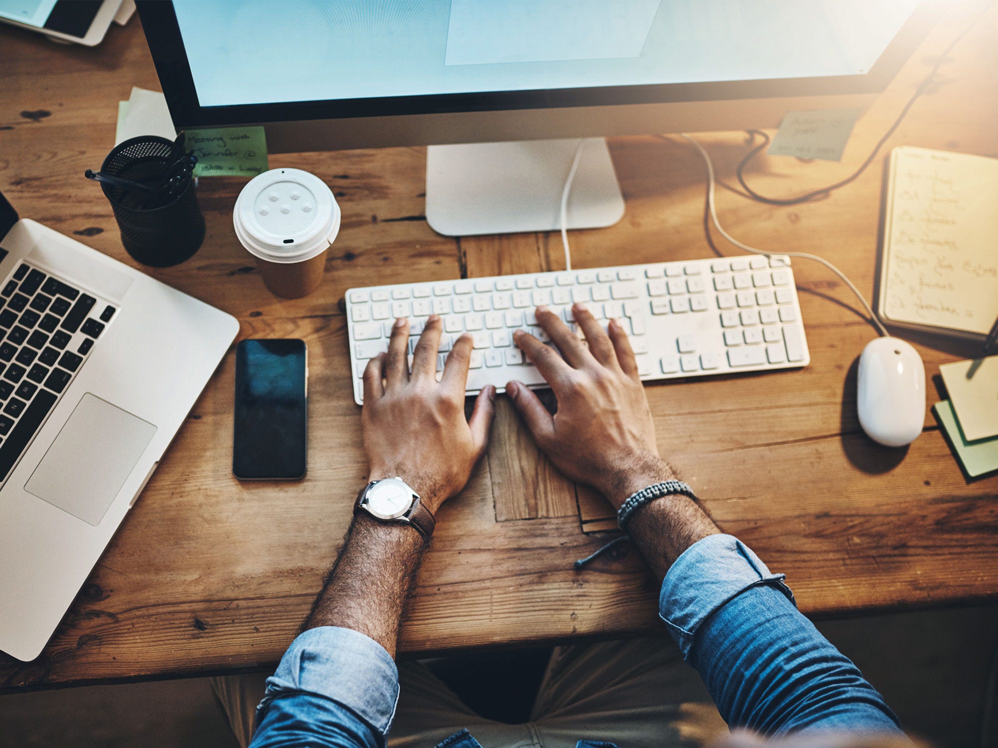 man typing on keyboard