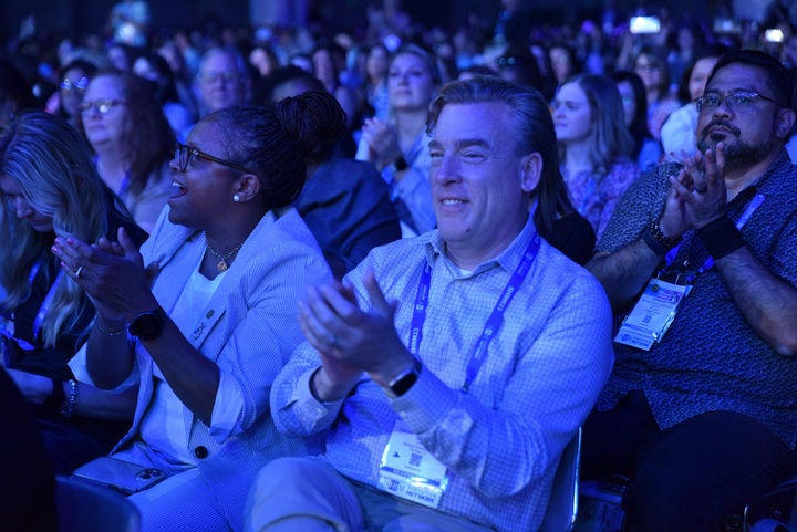 audience clapping at a conference