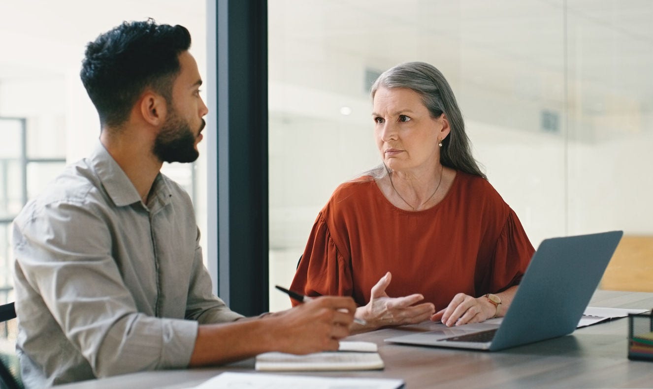 Employees talking in an office