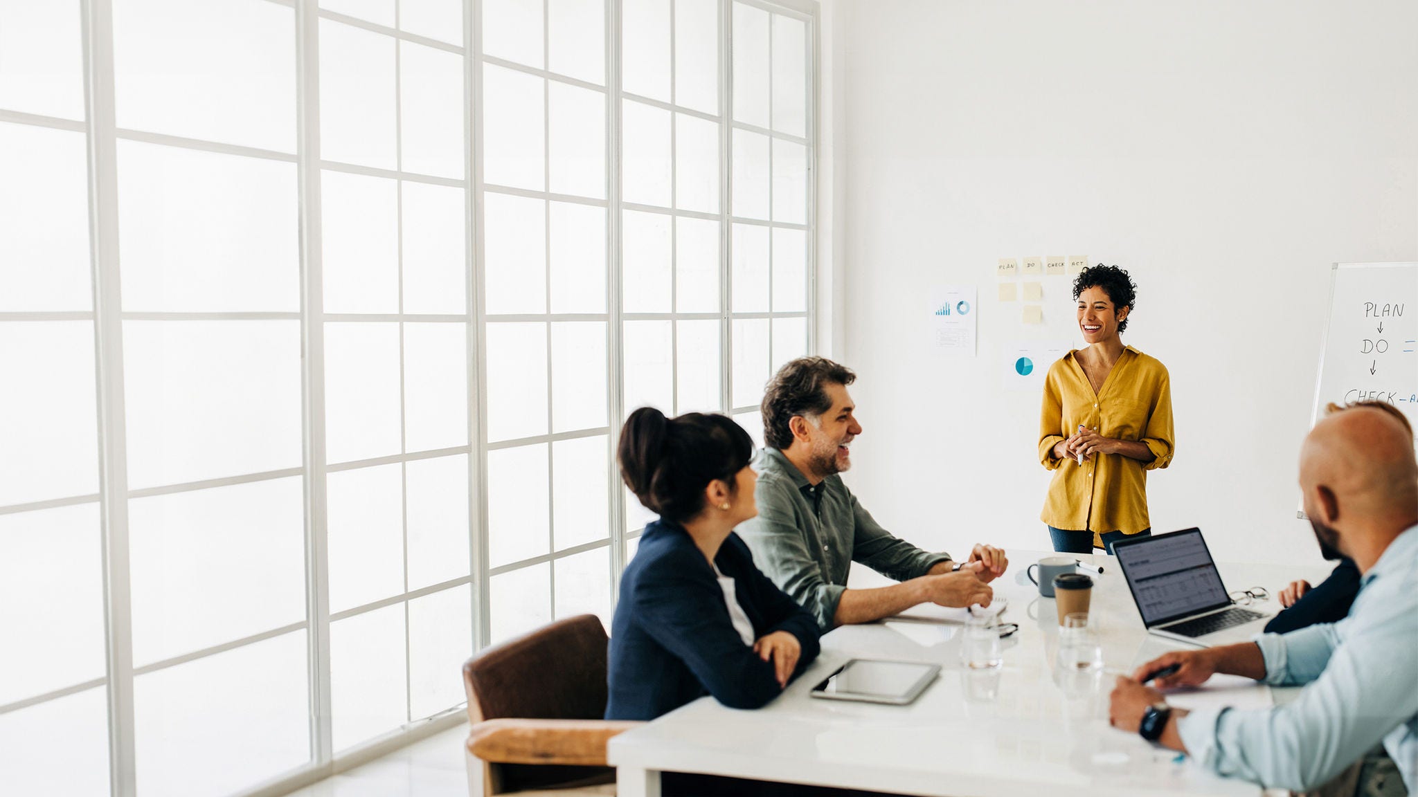 Diverse business people talking in a meeting. Business team having a discussion in a boardroom. Professionals work together to complete a project, sharing ideas and solutions.