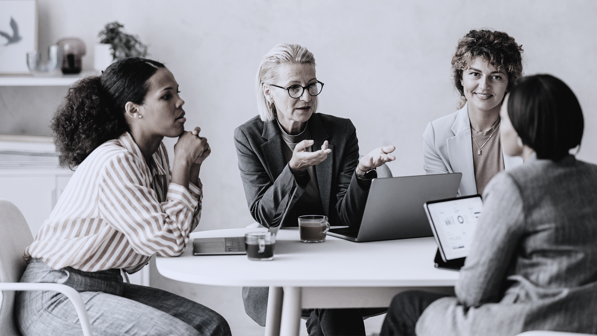 A group of female professionals in discussions