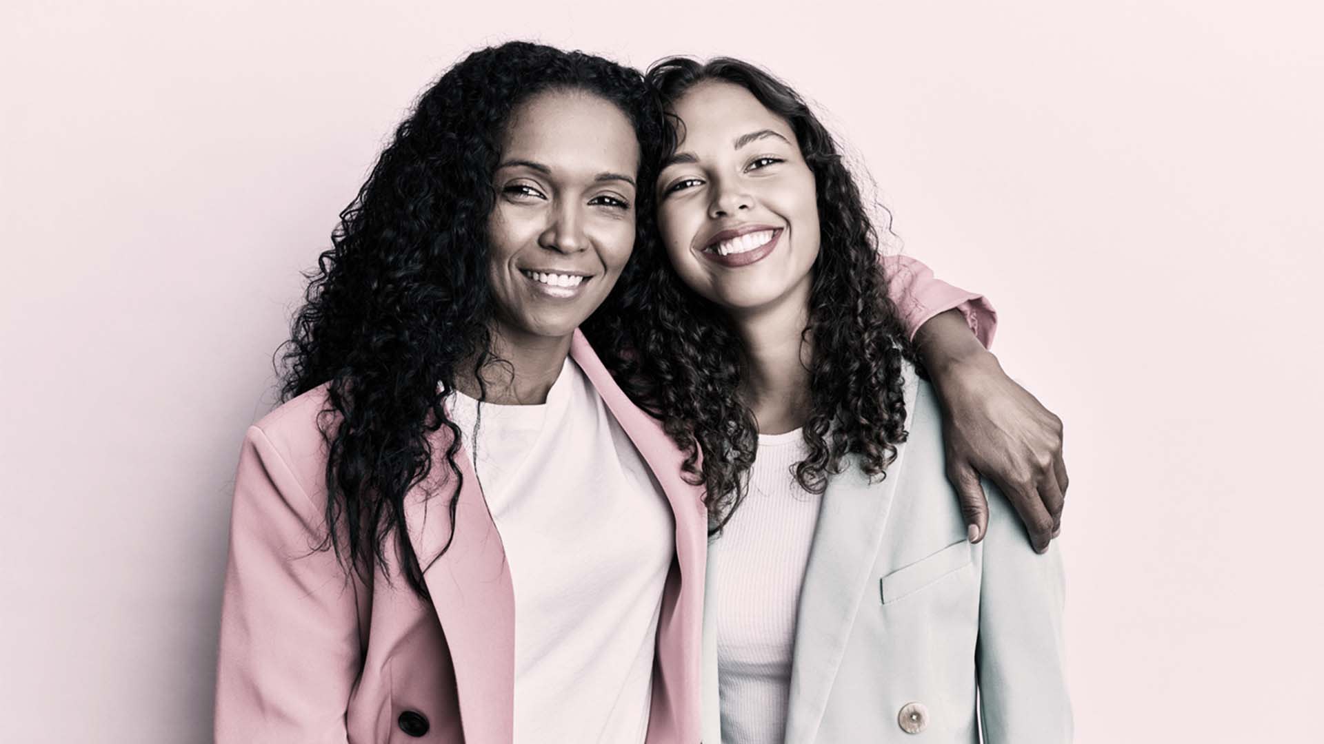 Mom and daughter smiling