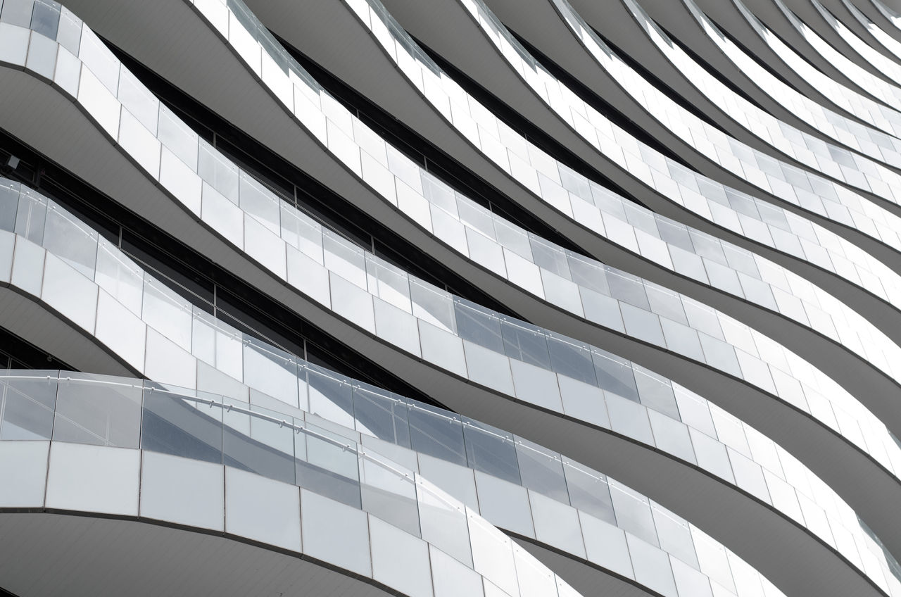 A stack of curved balconies jutting out from a building.