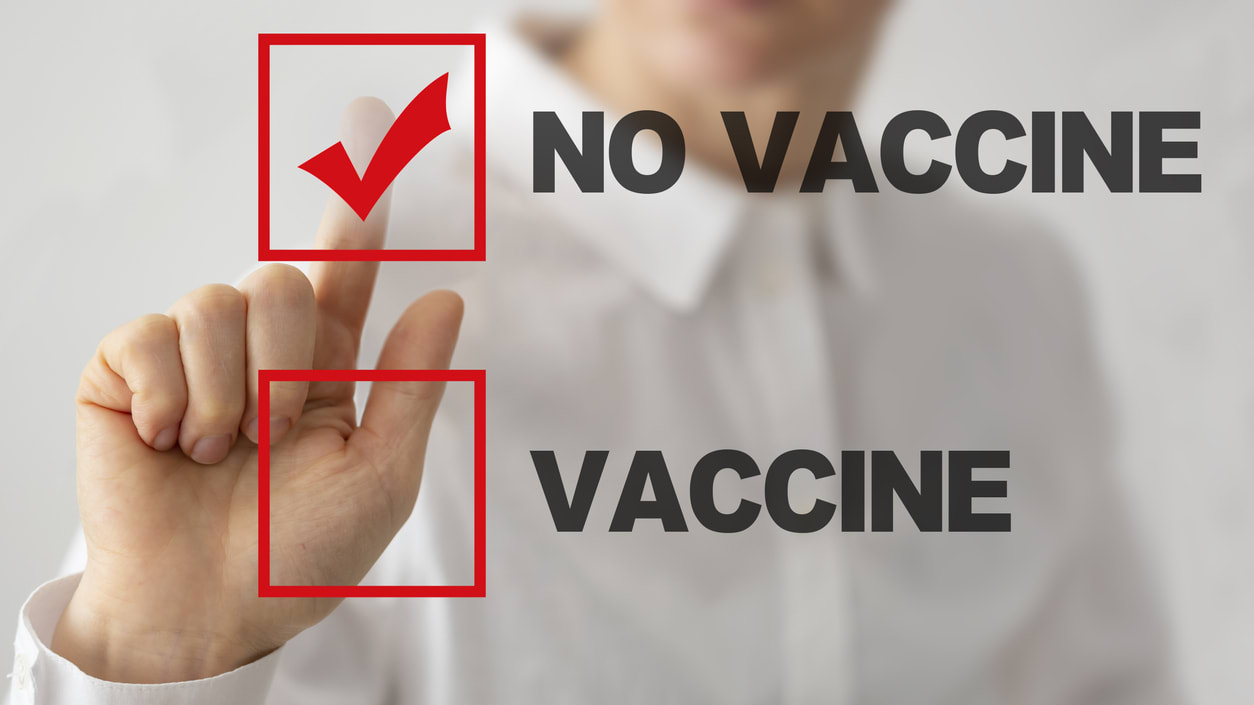 A woman is pointing to the word no vaccine.
