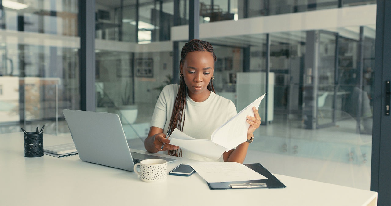 woman reading contracts 