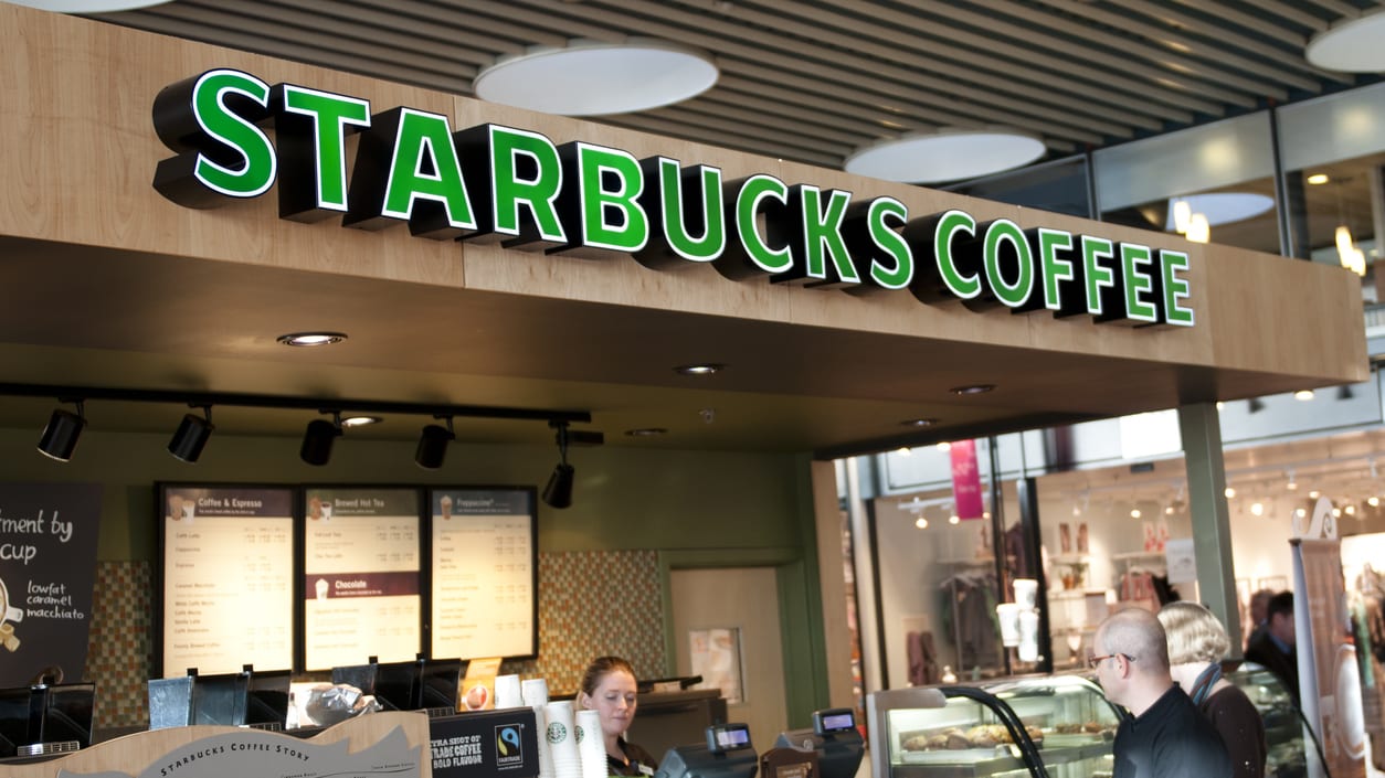 A starbucks coffee shop in a shopping mall.