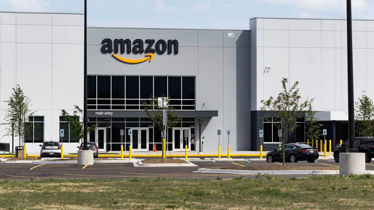 A building with an amazon sign in front of it.
