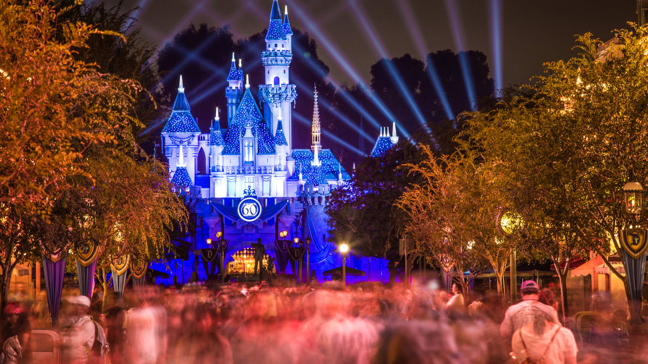 Disney's cinderella's castle lit up at night.