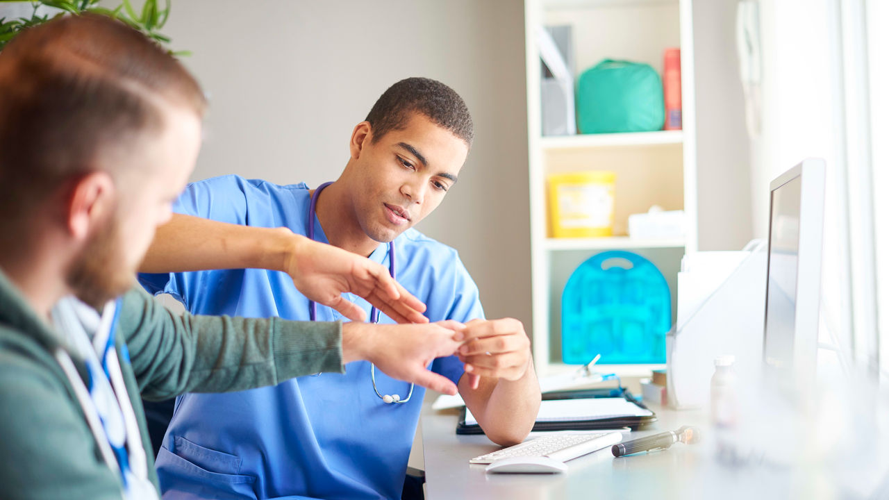 A nurse is talking to a patient in a medical office.