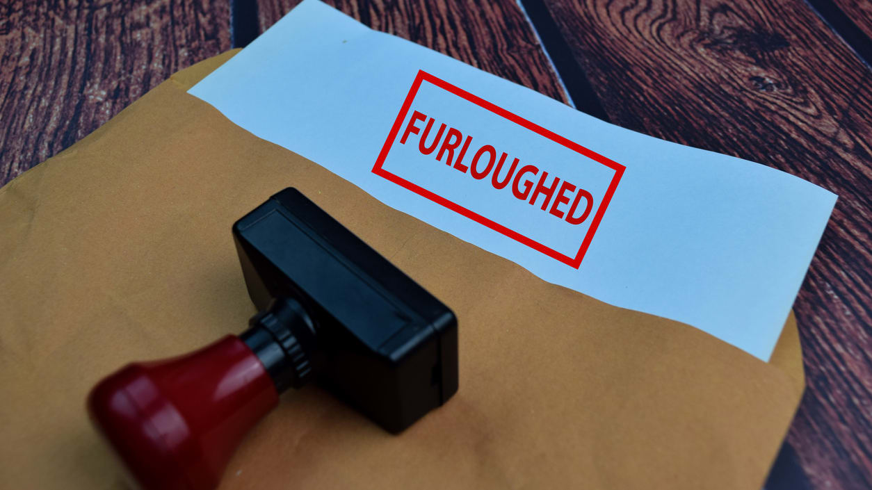 A rubber stamp with the word furloughed on it.