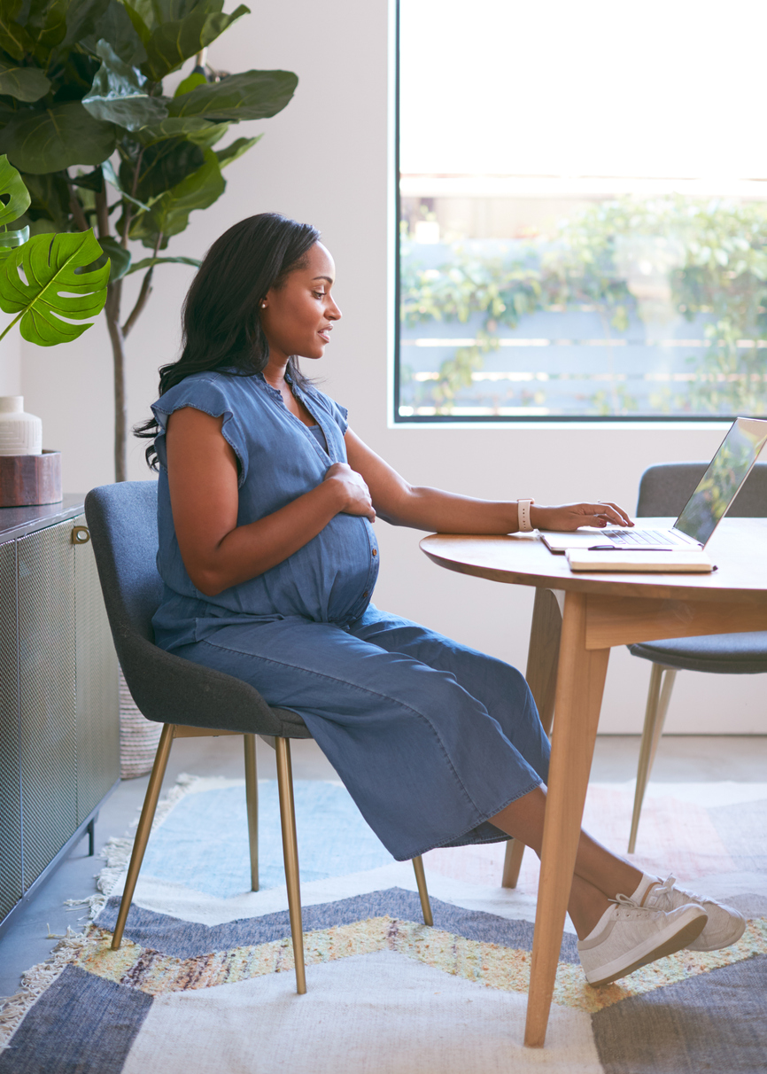 pregnant woman at desk