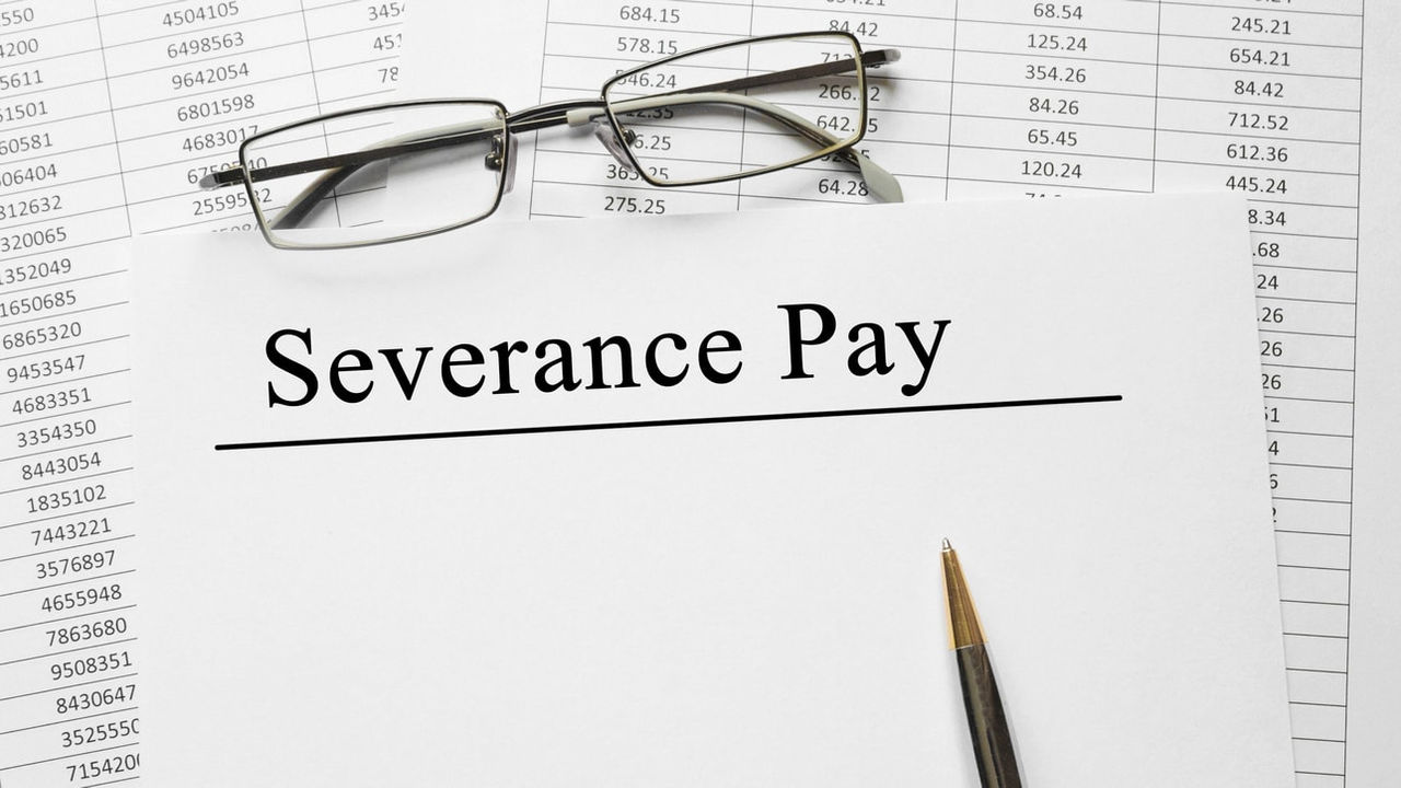 A paper with the word severance pay on top of it.