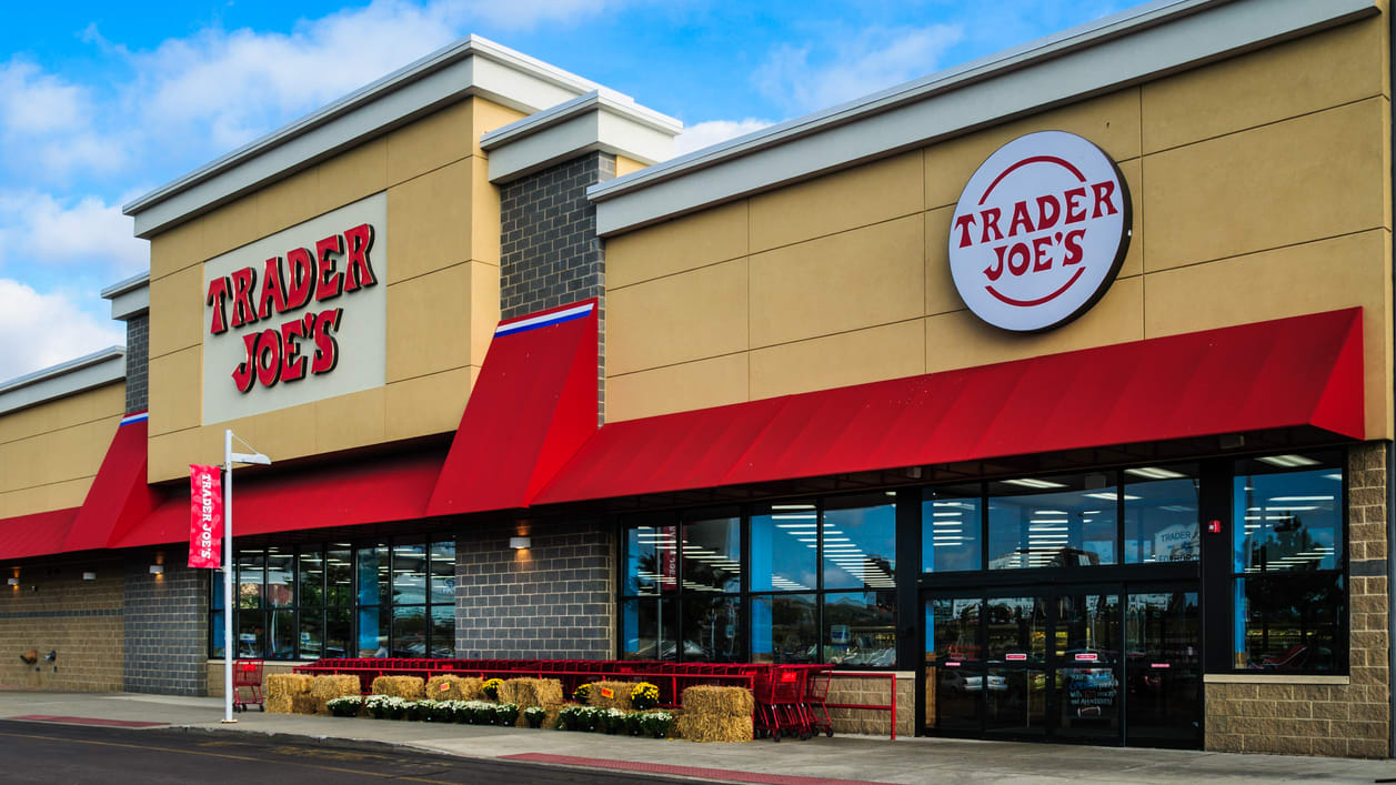 A store with red and yellow awnings.